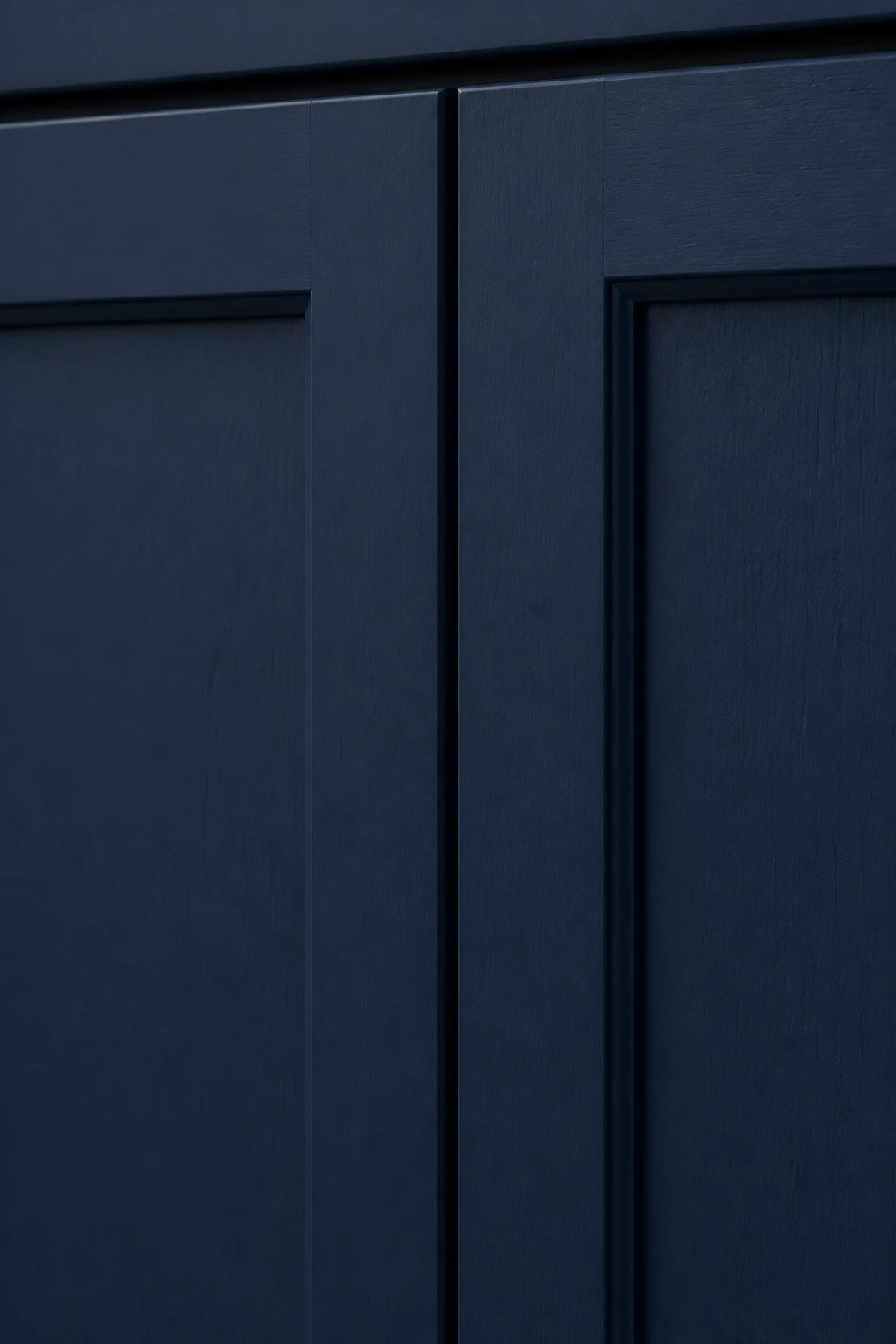 Closeup of luxury navy blue shaker cabinet doors